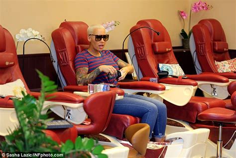 amber rose lightens up after two days of wearing a shocking pink color daily mail online