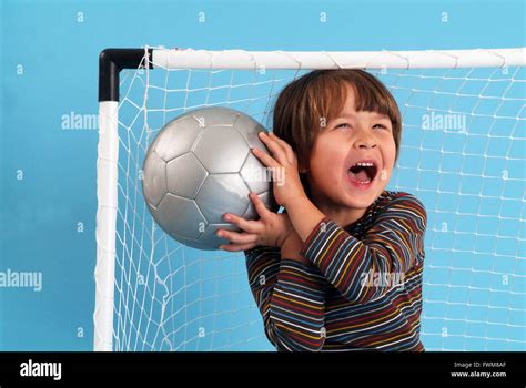 Boy Playing With A Ball Stock Photo Alamy