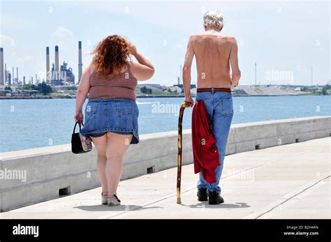 Fat Overweight Woman Walking With Skinny Thin Man Stock Photo Alamy