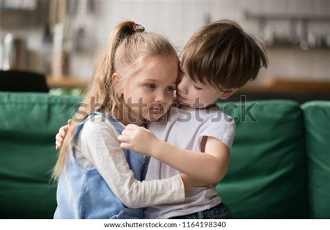 Little Boy Hugging Consoling Upset Girl Stock Photo 1164198340