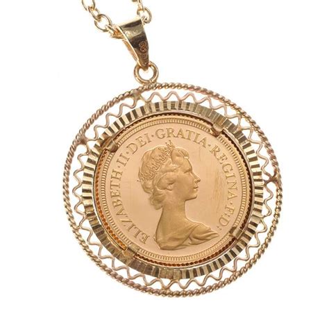 FULL SOVEREIGN COIN MOUNTED IN 9CT GOLD PENDANT AND CHAIN