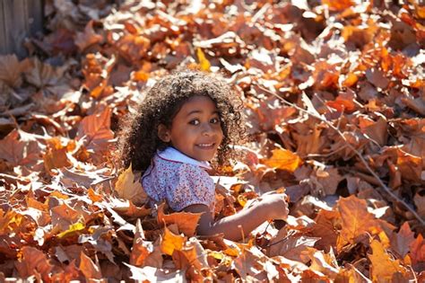 Premium Photo Toddler Kid Girl Playing With Autumn Leaves