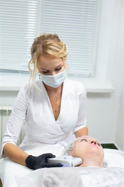 A Woman In A Cosmetology Office Receives A Smas Lifting Procedure Non