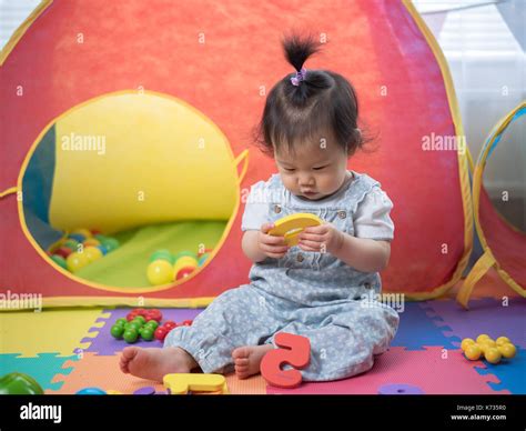 Baby Girl Learning Alphabet Blocks Stock Photo Alamy