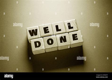 Well Done Word Written On Wooden Cubes Stock Photo Alamy