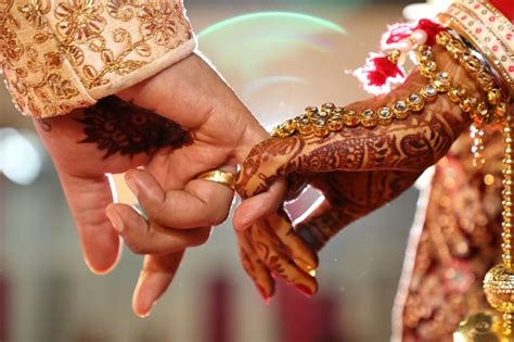 Hindu Wedding Ritual Wherein Bride And Groom Hand Stock Photo