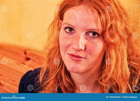 Beautiful Portrait Closeup Of An Open Smiling Young Red Haired Curly Woman With Copy Space Stock