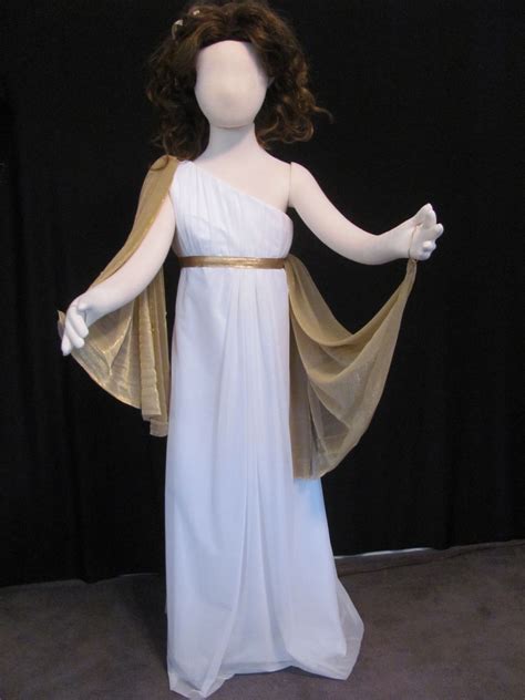 Costume includes a shimmering floor length dress, egyptian neck piece and with cape. Greek Goddess or Medusa costume for a child. The gold wrap layer is detachable and can be dra ...