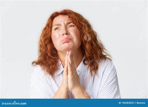 Desperate Crying Middle Aged Woman Pleading Begging For Help Or Supplicating Holding Hands In