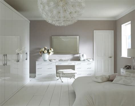 The bed and sitting are so tastefully arranged in a contemporary bedroom that they look like prompting us to. Gloss White fitted bedroom furniture. | White gloss ...