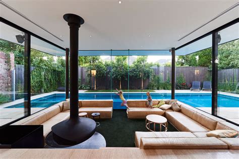 Swimming Pool House Featuring A Sunken Living Room Home
