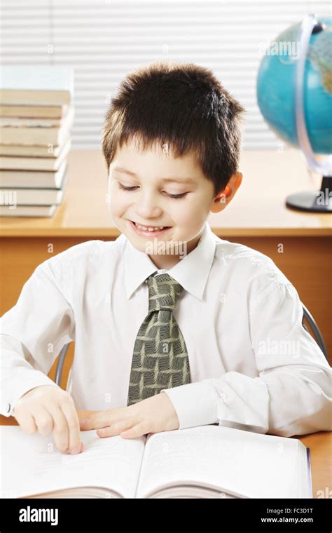 Smiling Caucasian Boy Reading Book Stock Photo Alamy