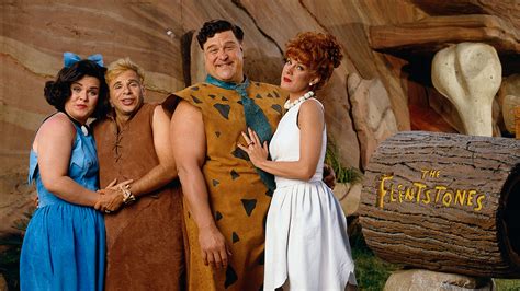 In The Flintstones 1994 Fred And Barney Are Portrayed Living Middle