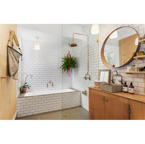 It's classic with the white subway tile, yet modern with the mix of white oak. A classic look: subway tiles - Completehome