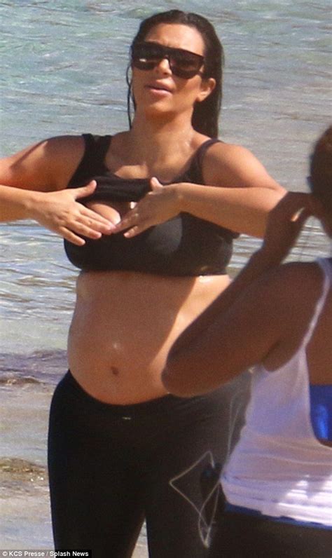 Glowing Kim Kardashian Bares Her Burgeoning Baby Bump In Kim