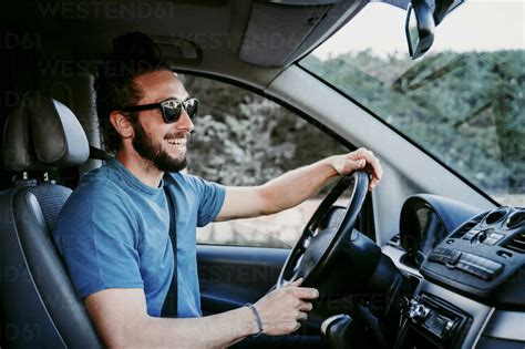 Happy Man Driving Car Stock Photo