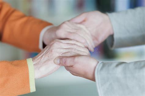 Woman Holding Hands Of A Senior Women Stock Image Image Of Action