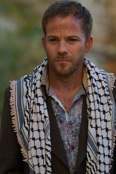 A Man With A Scarf Around His Neck