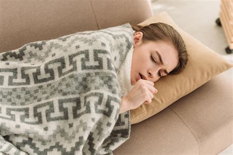 Diseased Girl Coughing While Lying On Sofa Free Stock Photo And Image