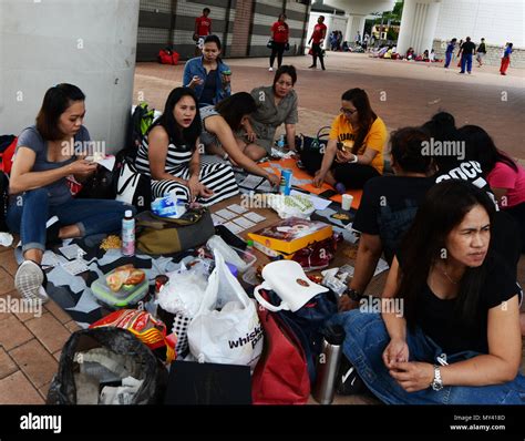 Filipino Domestic Helpers Socializing On Their Sunday Day Off In Central Hong Kong Stock