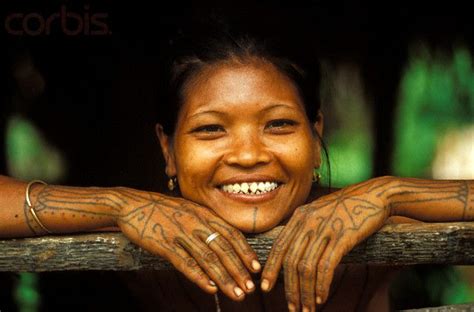 mentawai woman with filed teeth indonesia rite of passage culture teeth