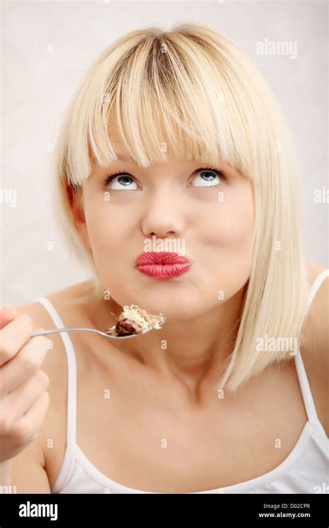 Beautiful Woman S Eating Cake Stock Photo Alamy