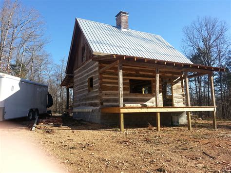 Constructed of logs cut from virgin timber, they meet current building codes. Antique Log Cabin Project nearing Completion | Ozark ...