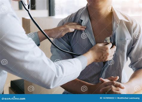 Asian Doctor Is Using A Stethoscope Listen To The Heartbeat Of The