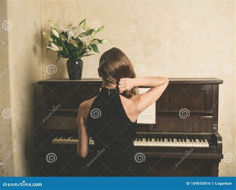Young Woman In Dress By Piano Stock Photo Image Of Luxury Fashion