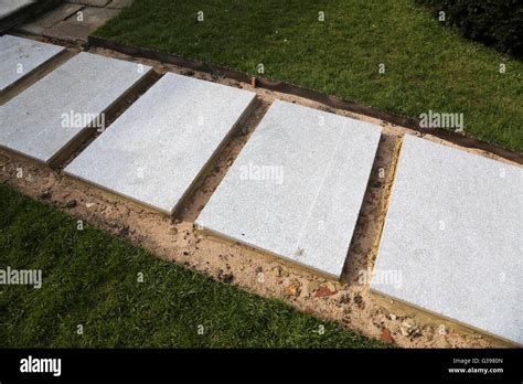 Laying New Garden Path New Concrete Slabs Surrey England Stock Photo