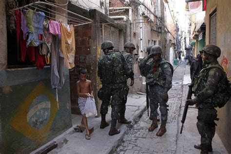 Brazil Security Forces Raid Rio Slum Before World Cup The Boston Globe