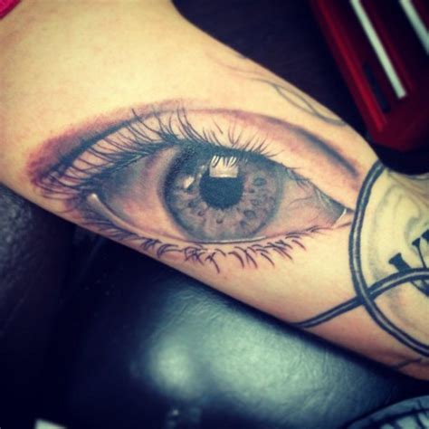 Very Realistic Colored Big Sad Eye Tattoo On Arm Tattooimagesbiz