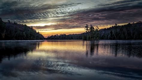 1600x900 A Calm Lake At Sunset 1600x900 Resolution Wallpaper Hd Nature