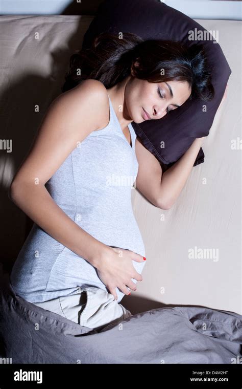Pregnant Woman Sleeping In Bed Stock Photo Alamy