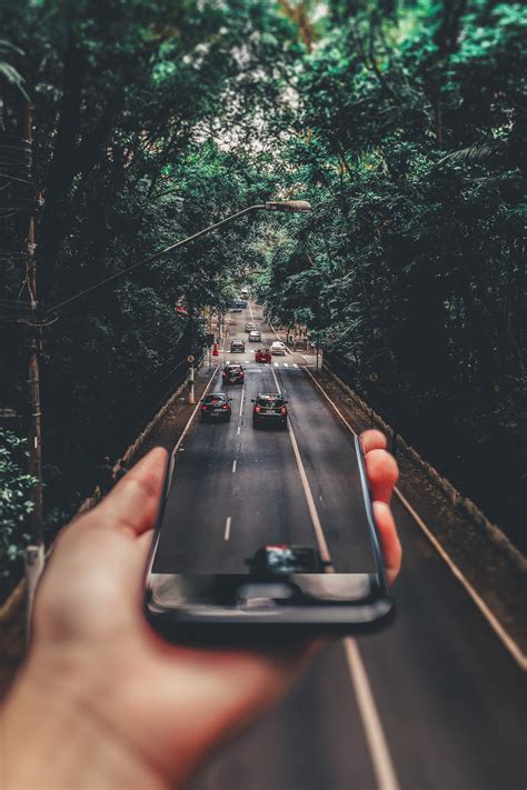 Free Photo Forced Perspective Photography Of Cars Running On Road