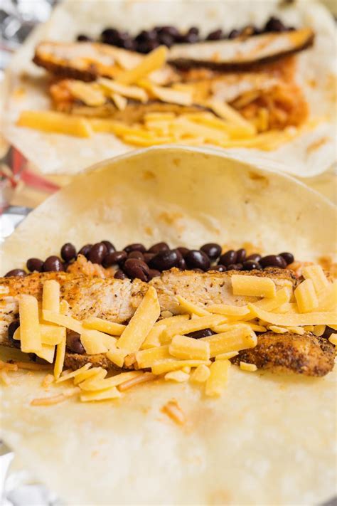 Sautéed fresh vegetables, garlic and a tasty black bean soup combine with cooked chicken and rice to make the perfect filling for warm flour tortillas. If you are looking for a quick and easy meal prep burrito ...
