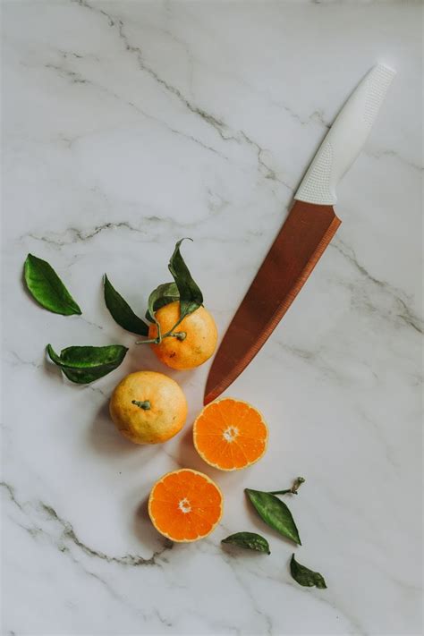 Sliced Orange Fruit Beside Brown Handled Knife Photo Free Citrus