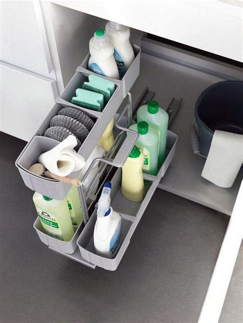The hardest part of organizing the space under your sink is working around the pipes and your garbage disposal. 25 Brilliant Under-Sink Storage Ideas For Kitchen Organizers | HomeMydesign