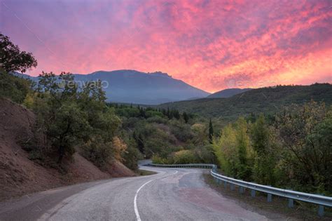 Mountain Road Through The Forest At Colorful Sunset Stock Photo By Den