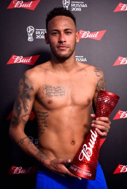 neymar jr of brazil poses with his man of the match trophy following his performance in the 2018