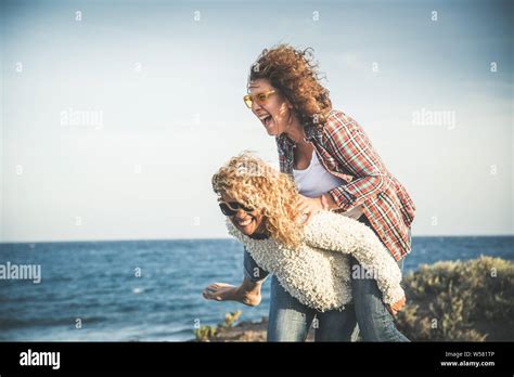 Portrait Of Two Pretty Woman Enjoy Free Time Smiling Middle Age Girls