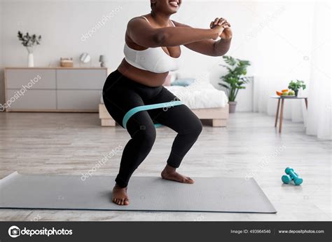 Cropped View Of Curvy Black Woman Squatting With Rubber Band On
