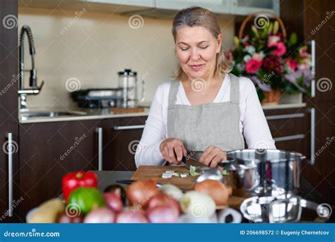 Mature Woman In Kitchen Preparing Food Stock Photo Image Of Leisure