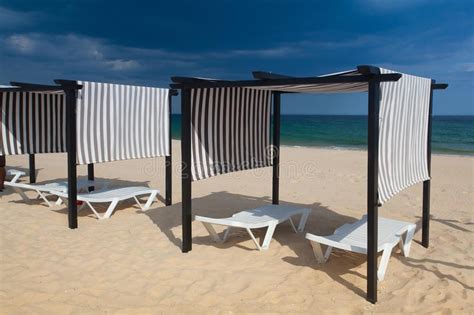Rows Of Sun Loungers And Umbrellas On The Beachtavira Portugal Stock