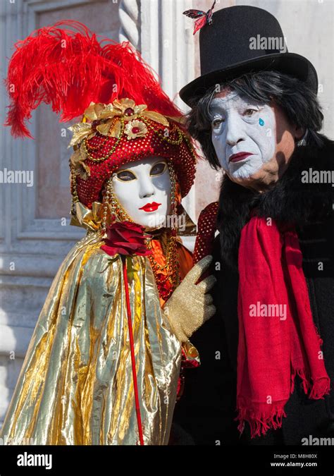 Couple Woman And Pierot Sad Clown In Fancy Dress Costumes And Mask