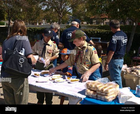 Boy Scouts Cub Scouts And Police Officers Prepare And Serve Free Hot