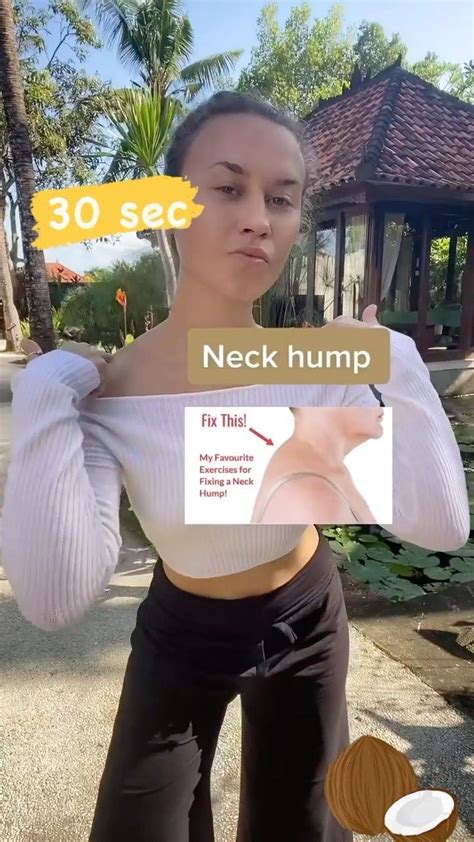 A Woman Holding Up A Sign That Reads Neck Hump Fix That With Her Hands