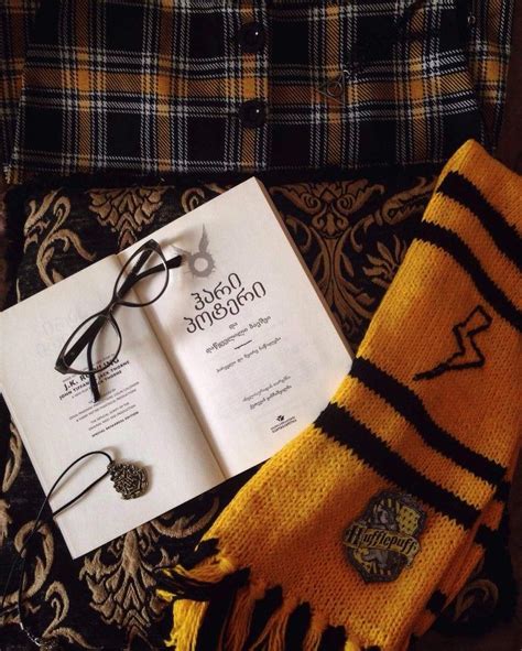 An Open Harry Potter Book Glasses And Scarf