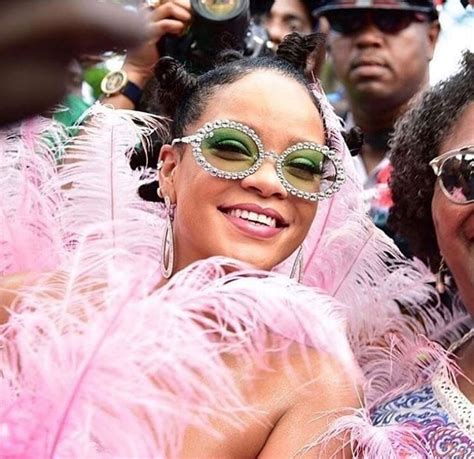 rihanna shines with feathered carnival look at crop over festival fashion news conversations