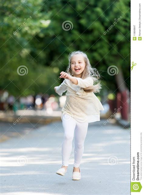 Child Happy And Cheerful Enjoy Walk In Park Childhood Concept Stock